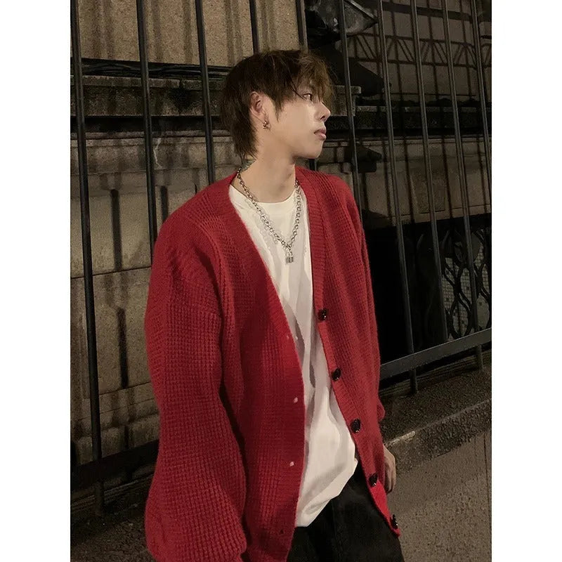 Men's solid colour V-neck knit cardigan in a loose fit, shown in army green.
