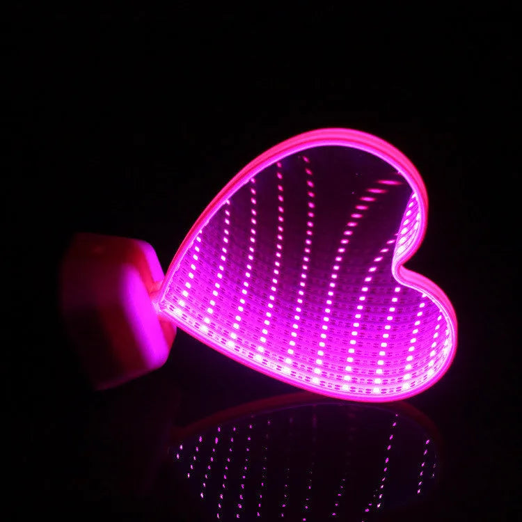 Plastic double-sided LED love tunnel light in rose red or dolphin colour, measuring 16cm long.