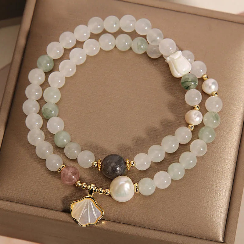 Tianshan emerald green crystal bracelet with gold-plated apricot leaf pendant and rhinestone details