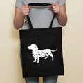 Sausage dog printed canvas bag in black with white dog design on front, sturdy tote for everyday use