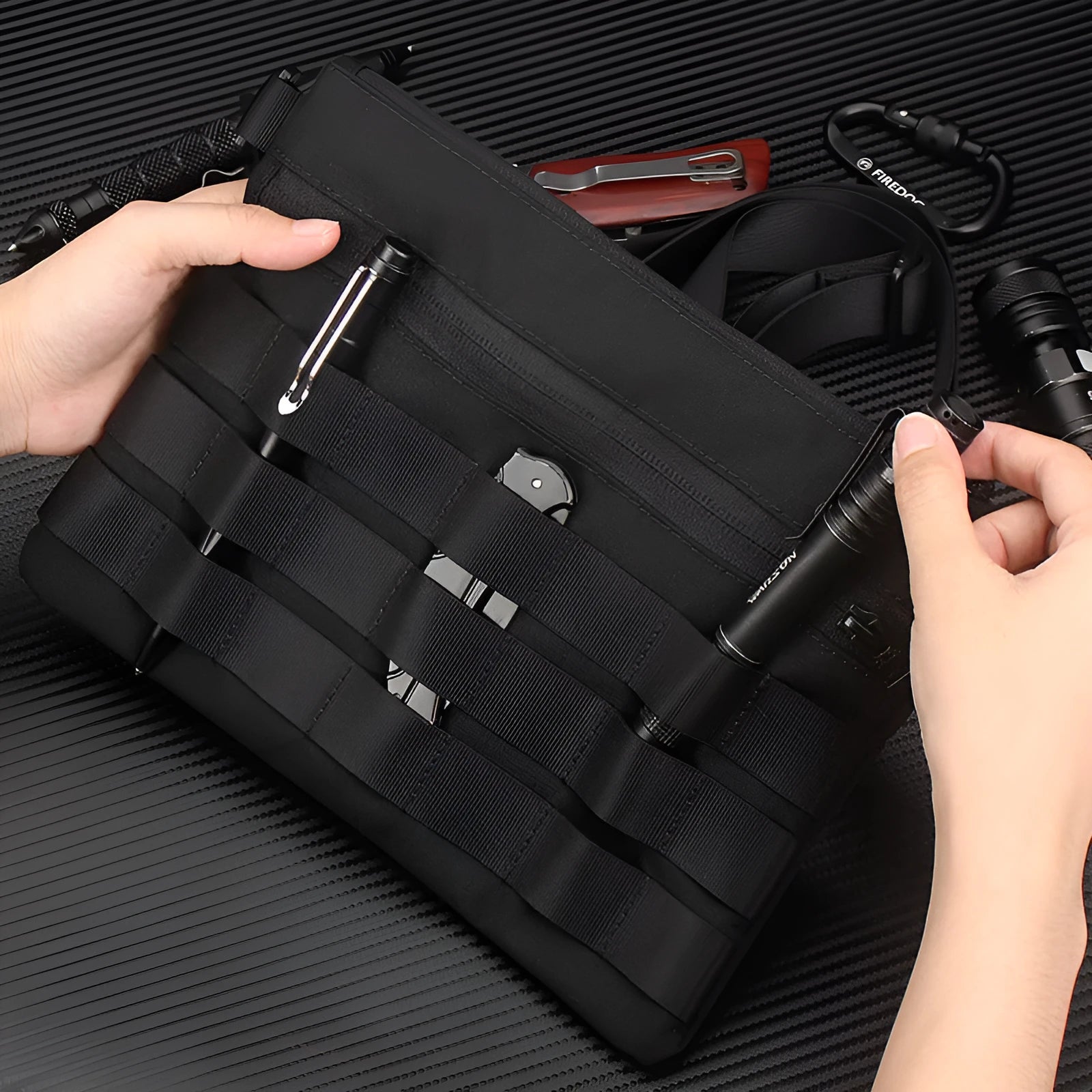 Black Oxford cloth tactical outdoor pouch measuring 18 by 3.5 centimetres
