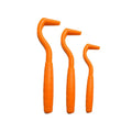 Three plastic tick removal hooks for dogs in various colours on white background