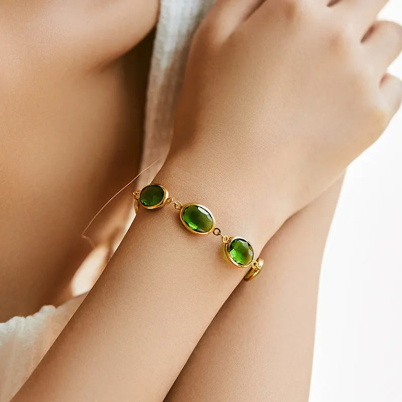 Women's geometric ellipse bracelet with 18K copper and coloured glass inlay beads in blue, green, and multicolour options