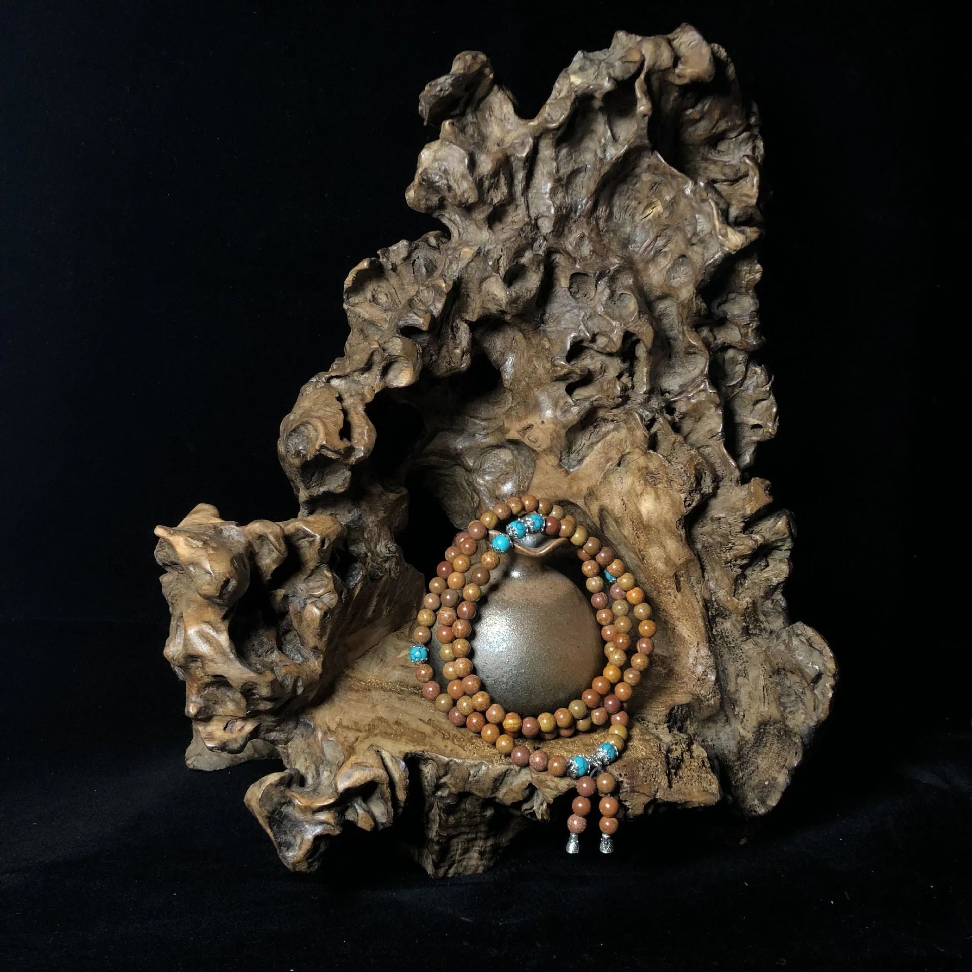 Handmade geometric bracelet with 108 smooth Lvzhu stone beads.