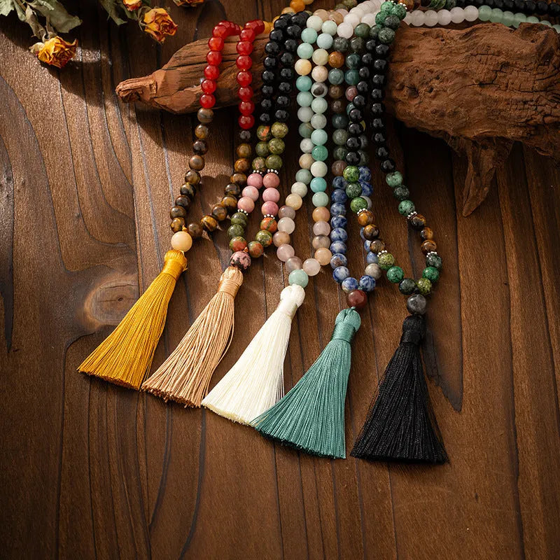 Vintage bohemian style natural stone bead necklace and bracelet set showing geometric round beads and tassel detailing