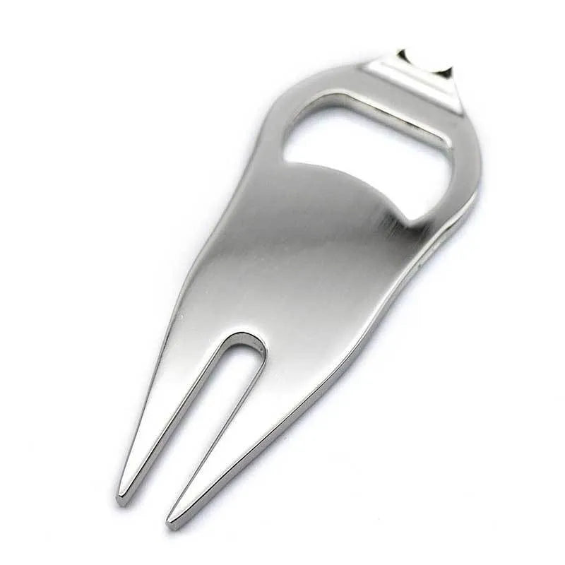 Black zinc alloy golf ball yoke fork with integrated bottle opener tool on green turf.
