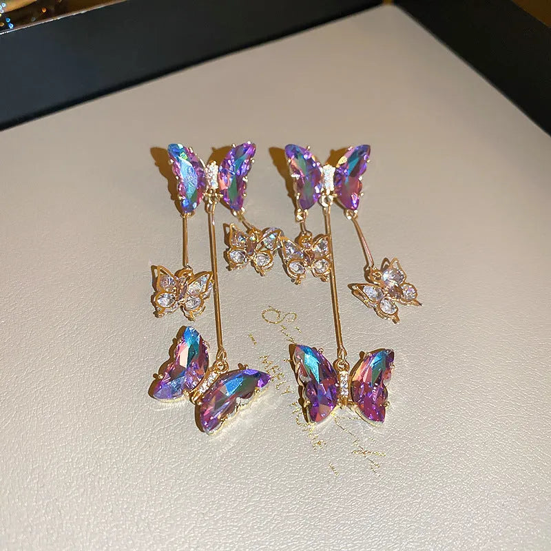 Silver needle electroplated alloy earrings with blue purple butterfly tassel and crystal flower details