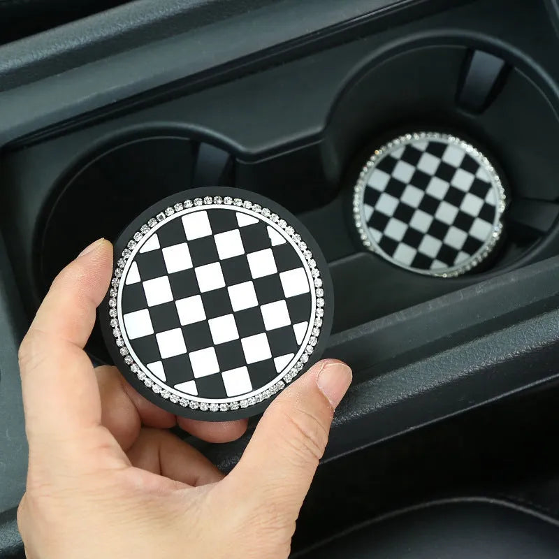 Black and white checkerboard PVC car cup mat inserted into a car door card slot.
