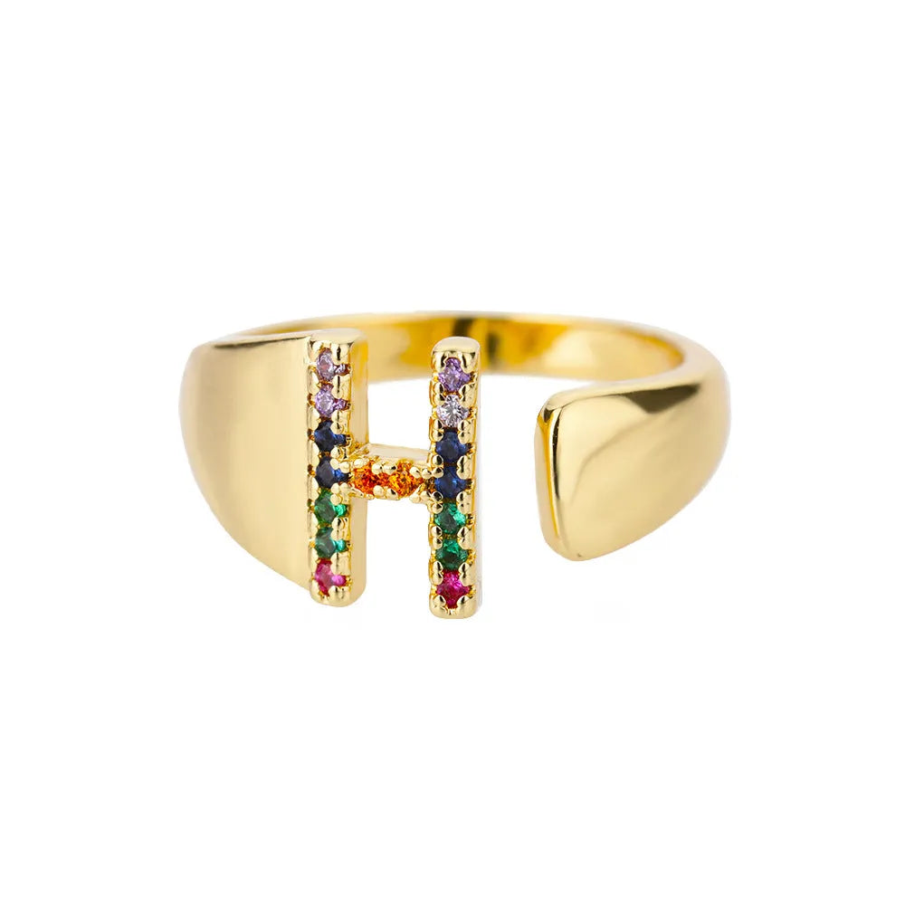 Fashion micro-set colored zirconium adjustable open ring showing letter A on a copper electroplated base