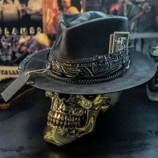 Handmade wool felt skull hat with a conical crown on a model, shown in the skull hat colour variant.
