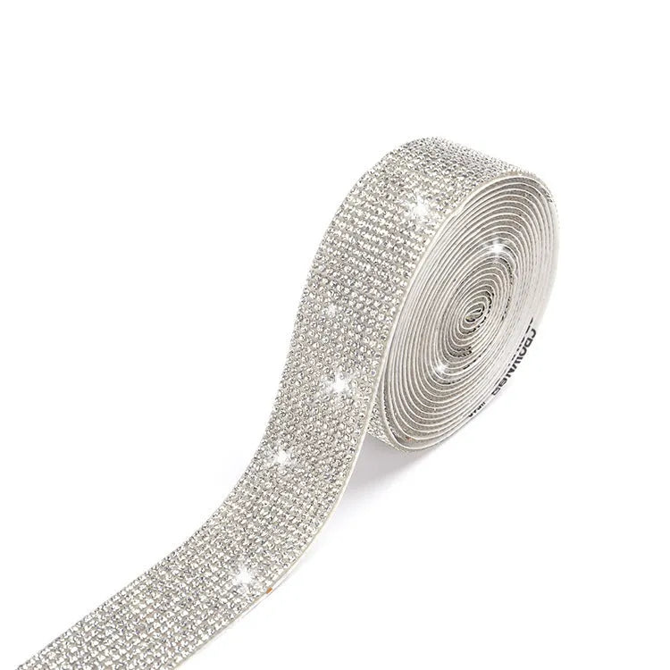 A one-yard long self-adhesive electroplated glass rhinestone strip on a roll, shown in white and AB colour variants.