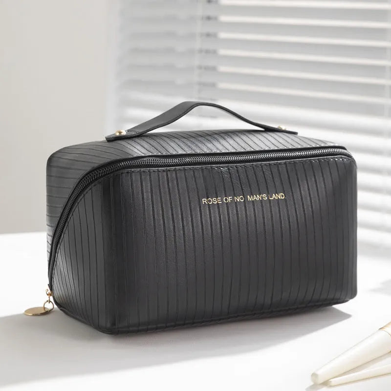 Vertical pattern pillow makeup bag in cubic design measuring 22.5cm height with travel storage capacity