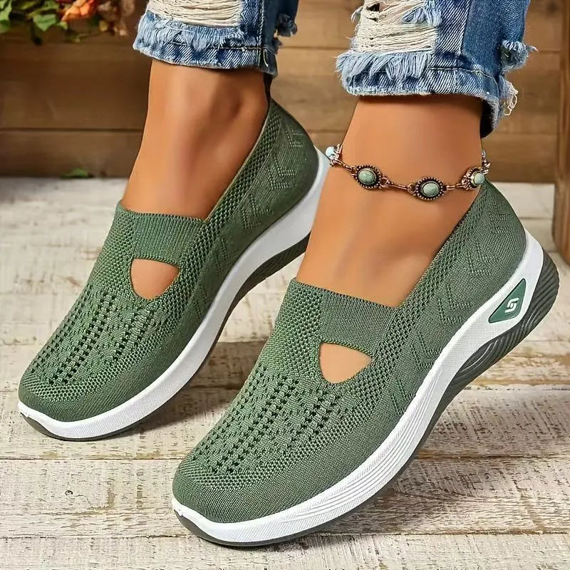 Women's black casual mesh shoes with T-strap and flat soft sole.