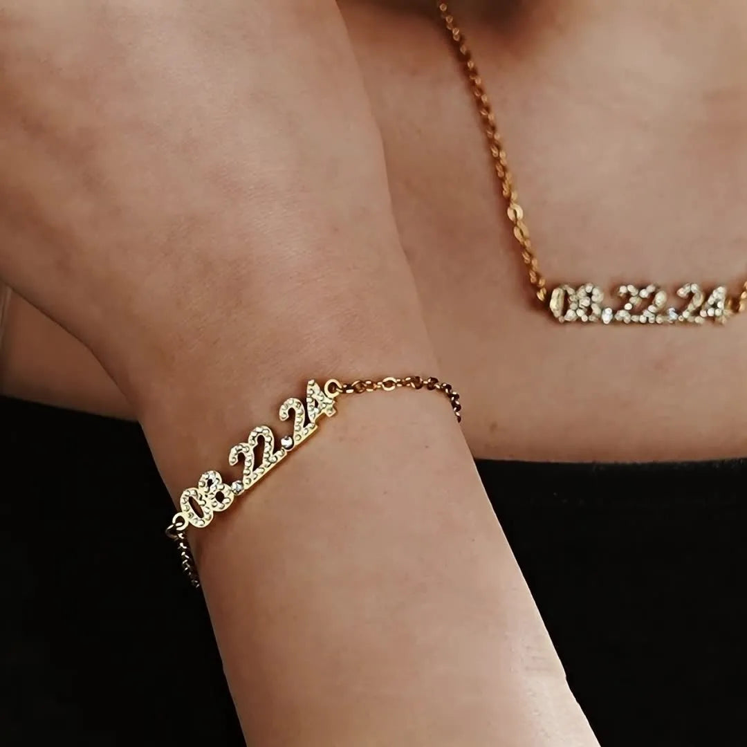 Stainless steel digital bracelet with crystal diamond accents on the numbers, shown in rose gold finish.
