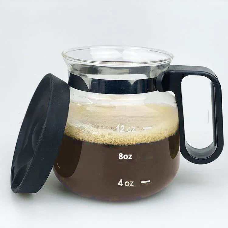 Transparent borosilicate glass coffee maker with silicone cover showing modern design