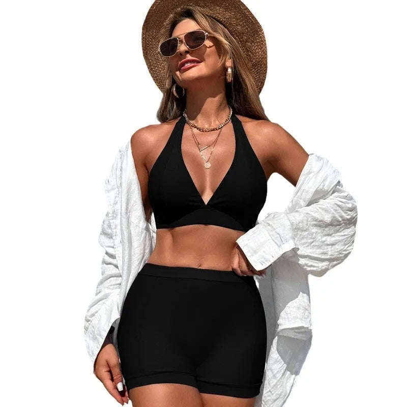 Women's black split bikini swimsuit made of nylon with polyester lining.