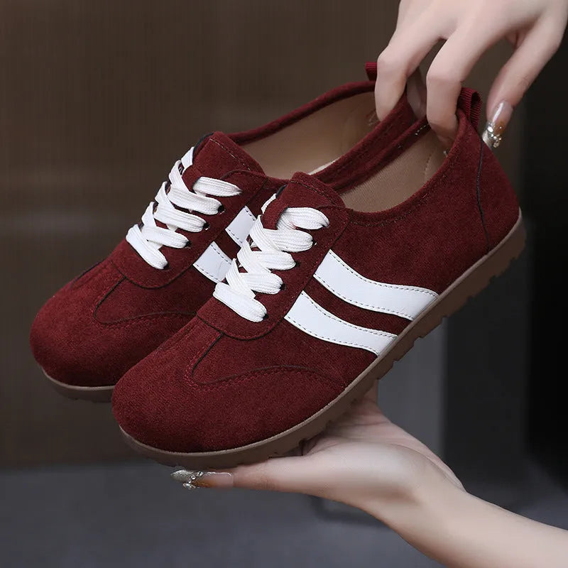 Women's vintage-style canvas sneakers with a soft rubber sole in dark red, maroon, and khaki colour options.