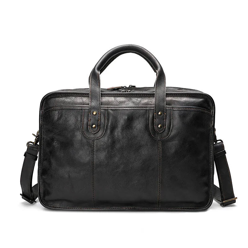 Brown vintage leather men's briefcase showing internal laptop and document pockets