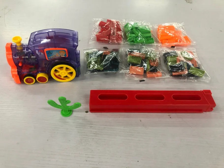 Domino train toy with 100 plastic dominoes in random colours, including toy train and card storage box