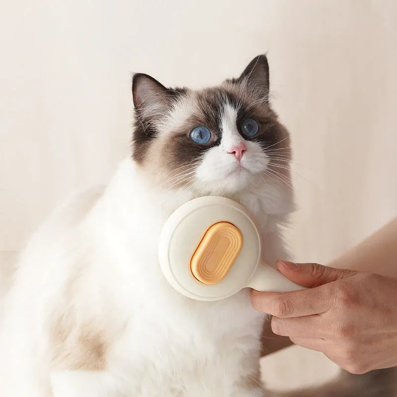 Cat grooming brush with stainless steel teeth and non-slip handle in green and yellow colours