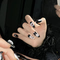 Black and pink peach heart hand-painted handmade manicure nails with cat's eye style