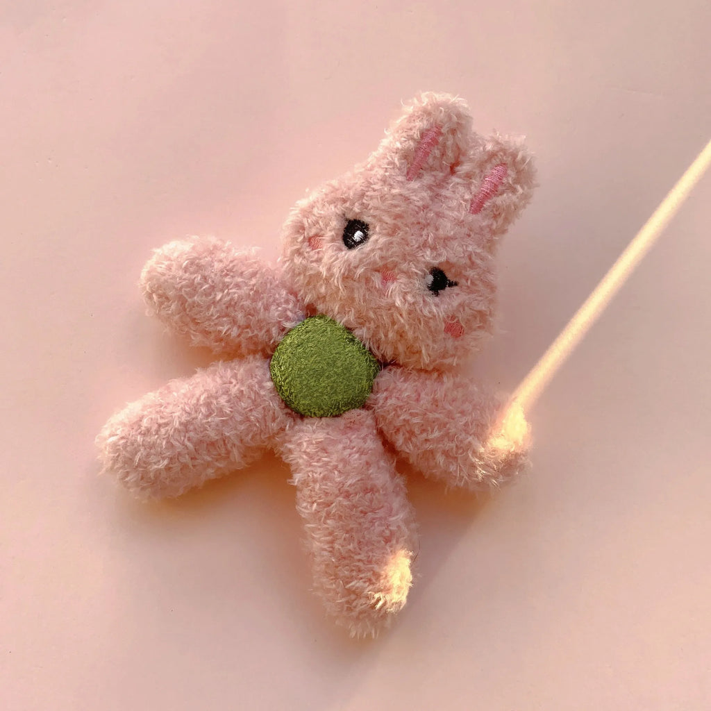 Edible catnip ball chewing toy for cats with plush animal design for dental enrichment