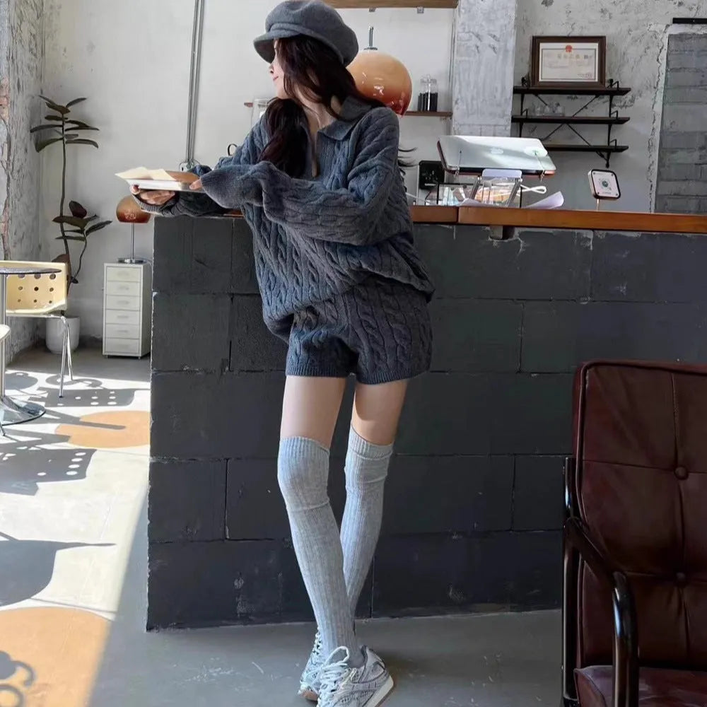 Ladies creamy-white knitted suit set with geometric cable knit sweater and elastic waist shorts
