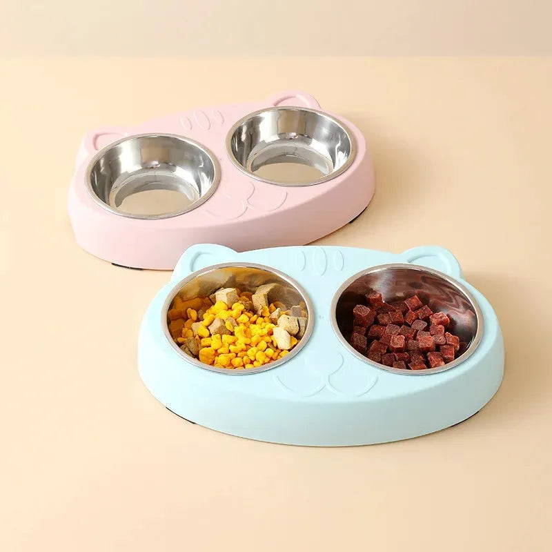 Blue plastic dual-bowl pet feeder tray for cat food and water on a white background.