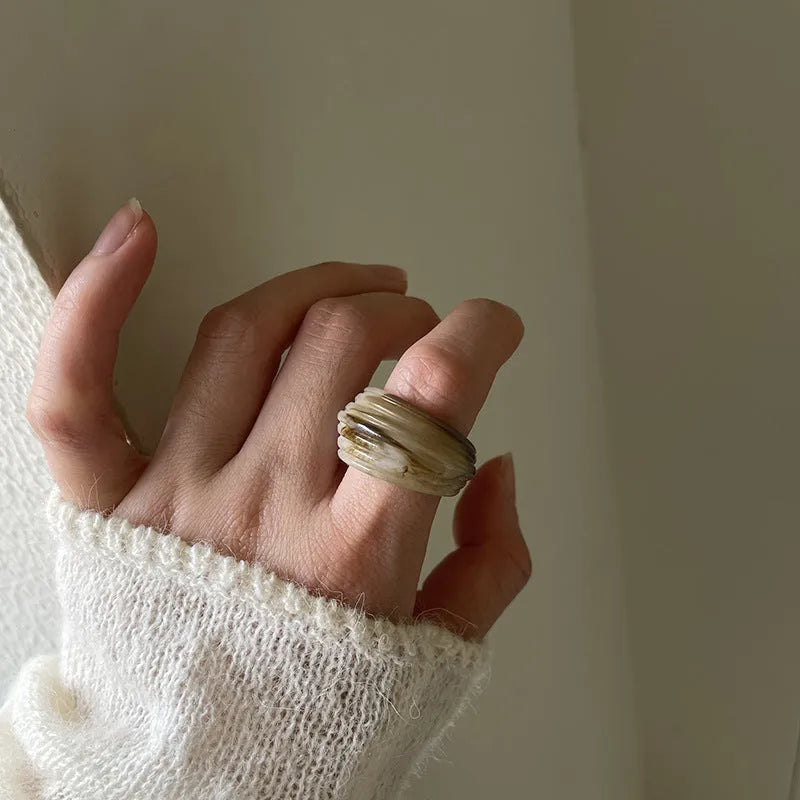 Chinese style geometric resin ring with irregular wide band design in brown and white colour options
