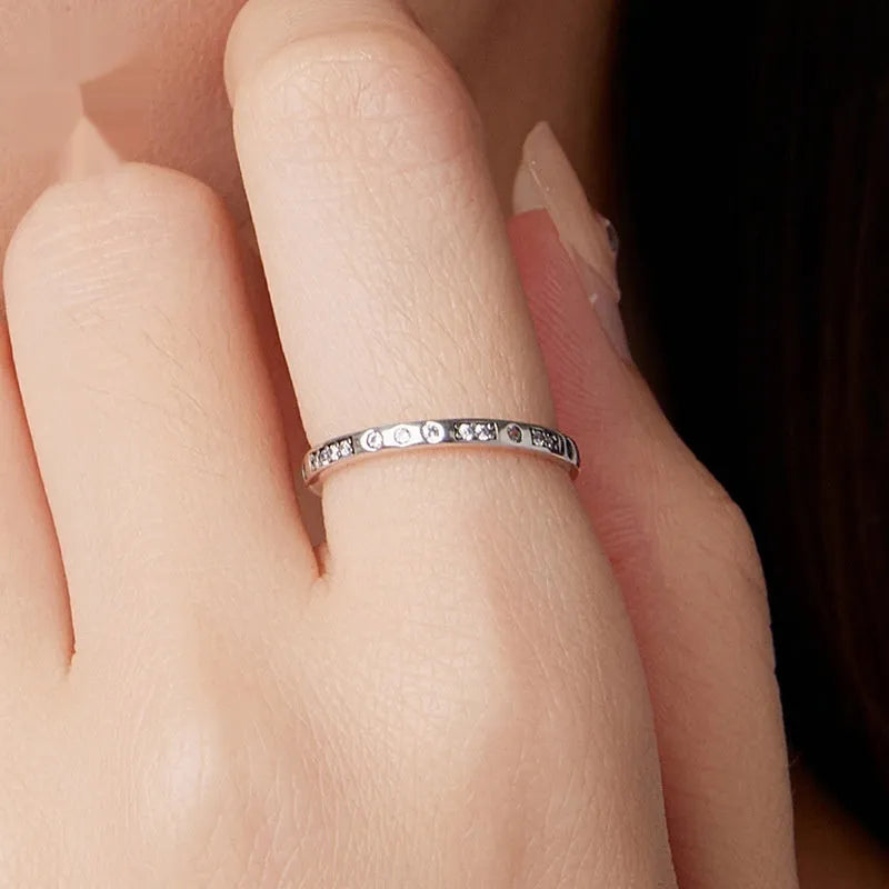 Silver alloy ring with oxidised black finish showing Moss Password I Love You design detail on band.