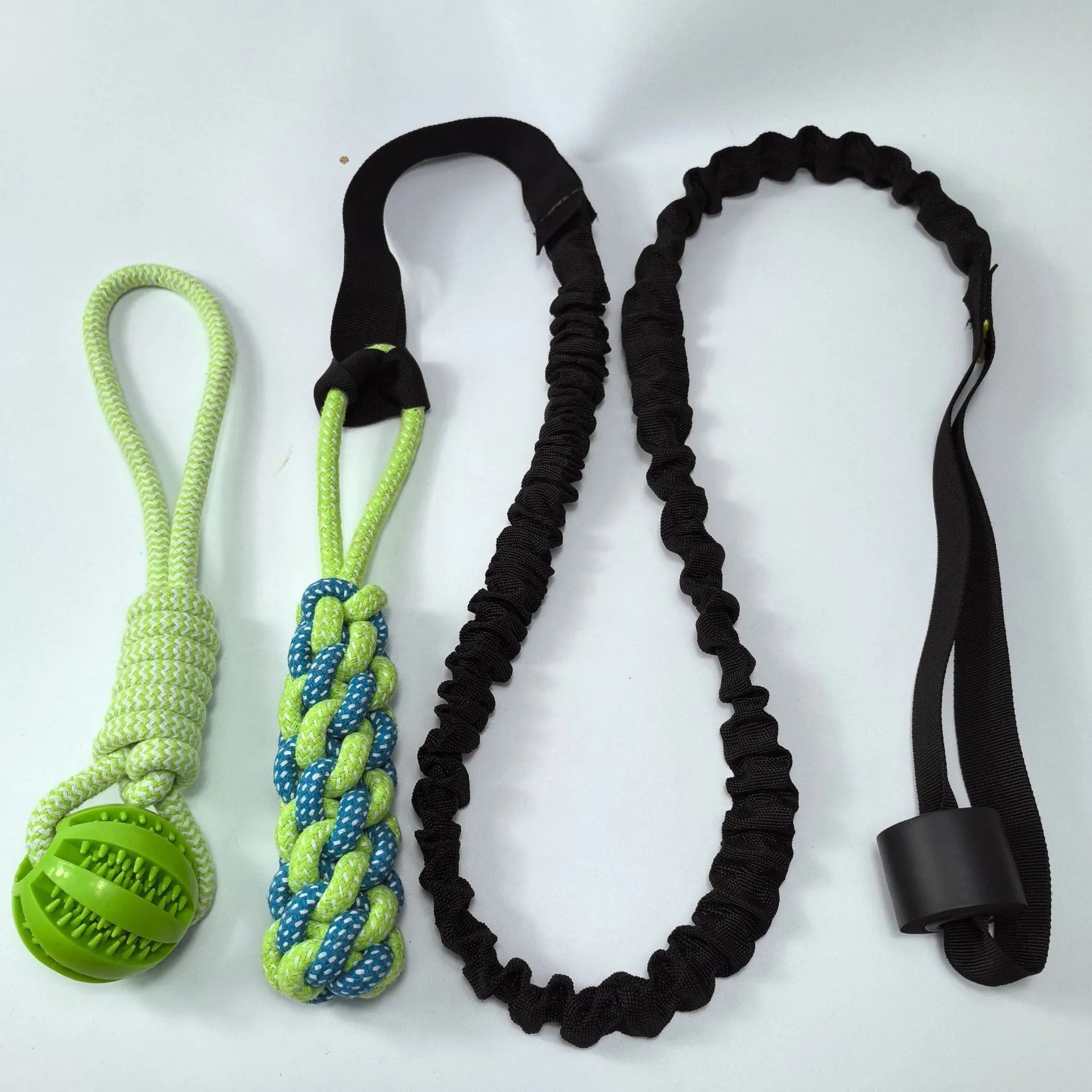 Green cotton dog tug rope toy with corncob chewable element for indoor outdoor bite play
