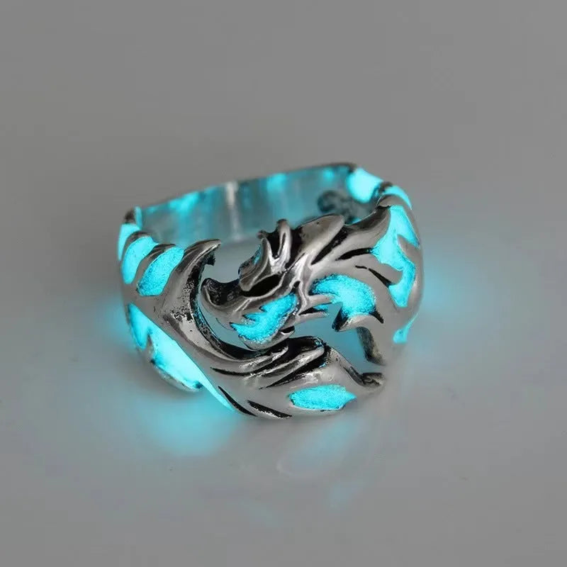 Close-up of an adjustable Chinese dragon pattern ring in antique silver, blue, and green colours.
