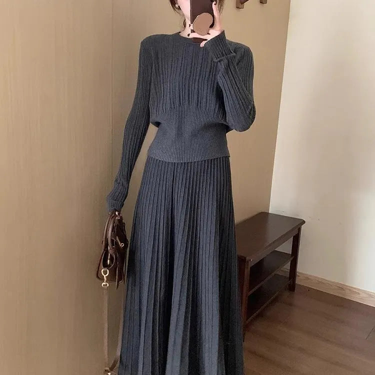 Knitted dress suit set with 3D pattern ethnic style showing sweater and skirt coordination in dark grey colour
