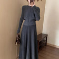 Knitted dress suit set with 3D pattern ethnic style showing sweater and skirt coordination in dark grey colour