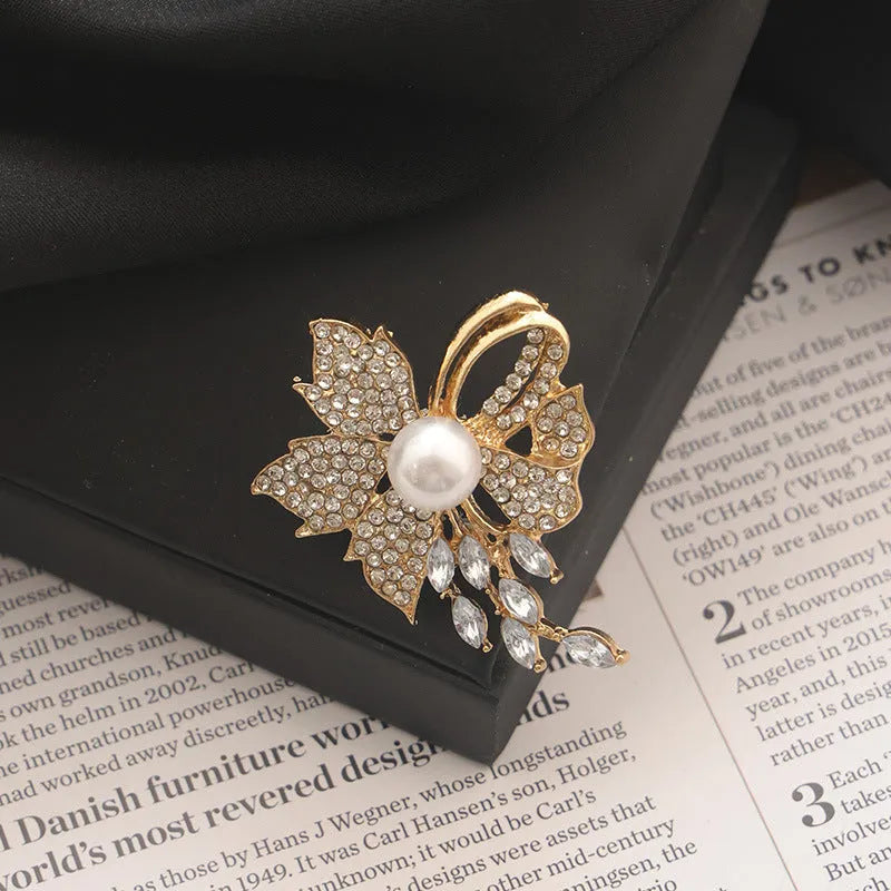 Alloy brooch in natural flower shape with electroplated finish, featuring adjustable and anti-exposure pin closure for women's coats and suits.