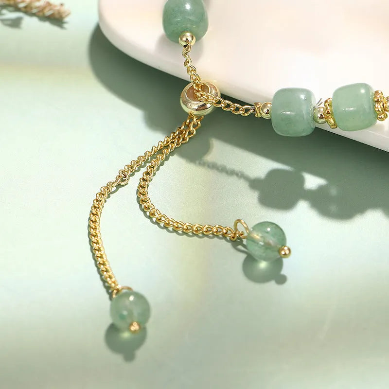 Rabbit charm bracelet with green aventurine or strawberry quartz stones on gold-plated copper