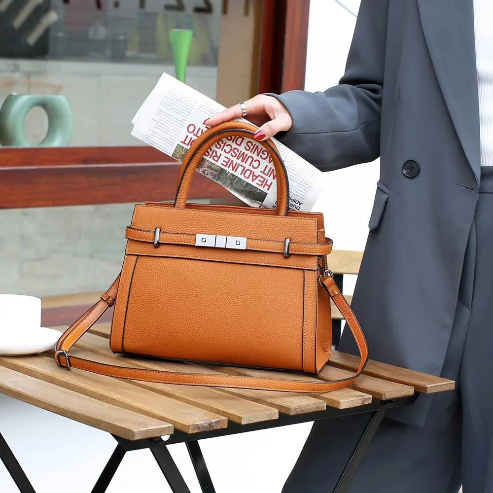 Small square genuine leather shoulder bag in horizontal design with organised interior compartments