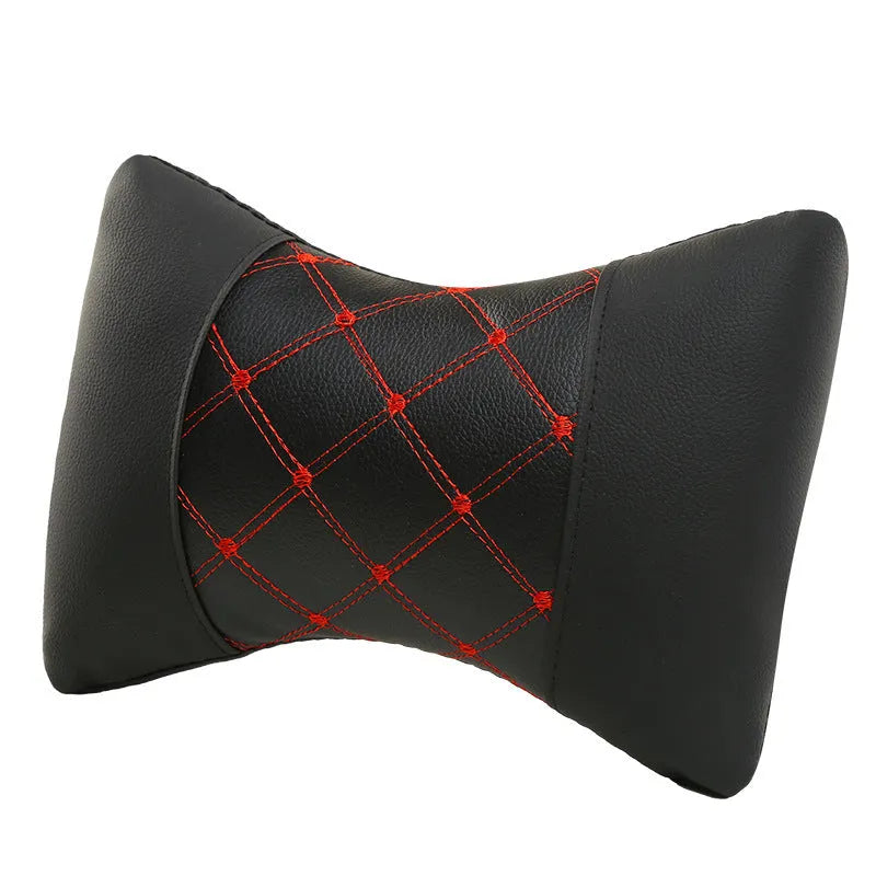 Black leather quilted car headrest pillow for neck support with diamond pattern stitching.