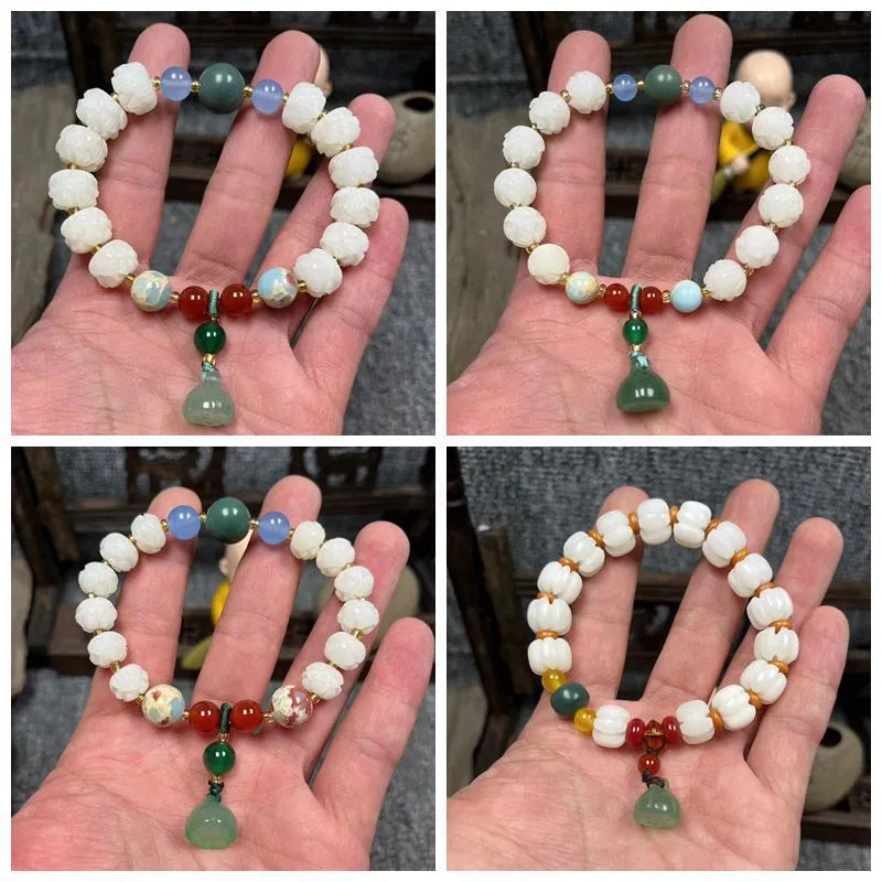 Carved pumpkin and lotus bead bracelet made from Bodhi root with white jade and aventurine details.
