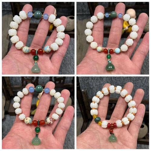 Carved pumpkin and lotus bead bracelet made from Bodhi root with white jade and aventurine details.