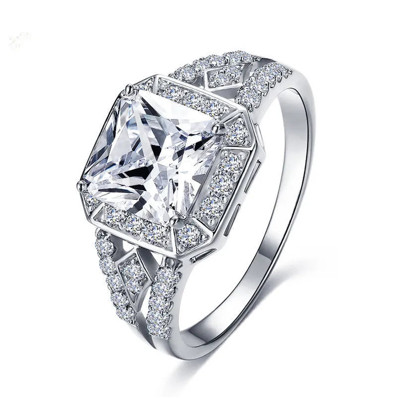Platinum finish geometric zircon ring with hollow design and quadrilateral patterning