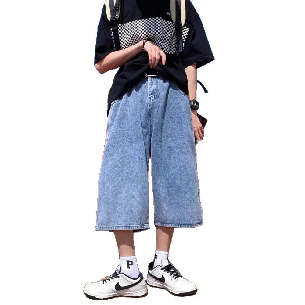 Men's washed blue denim pirate shorts with high waist and cropped straight legs on a plain background