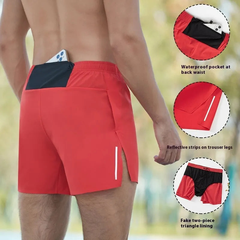 Men's loose fit off-road running shorts in grey, shown from front, with high waist and quick-dry fabric.