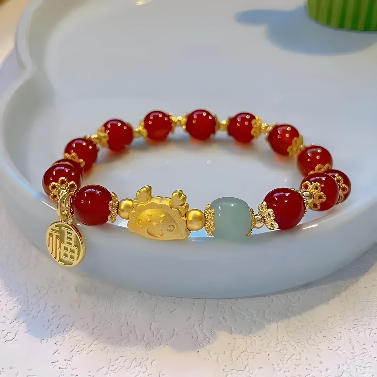 Women's floral glazed glass bracelet with animal zodiac charms in red, pink and white bead colour variations