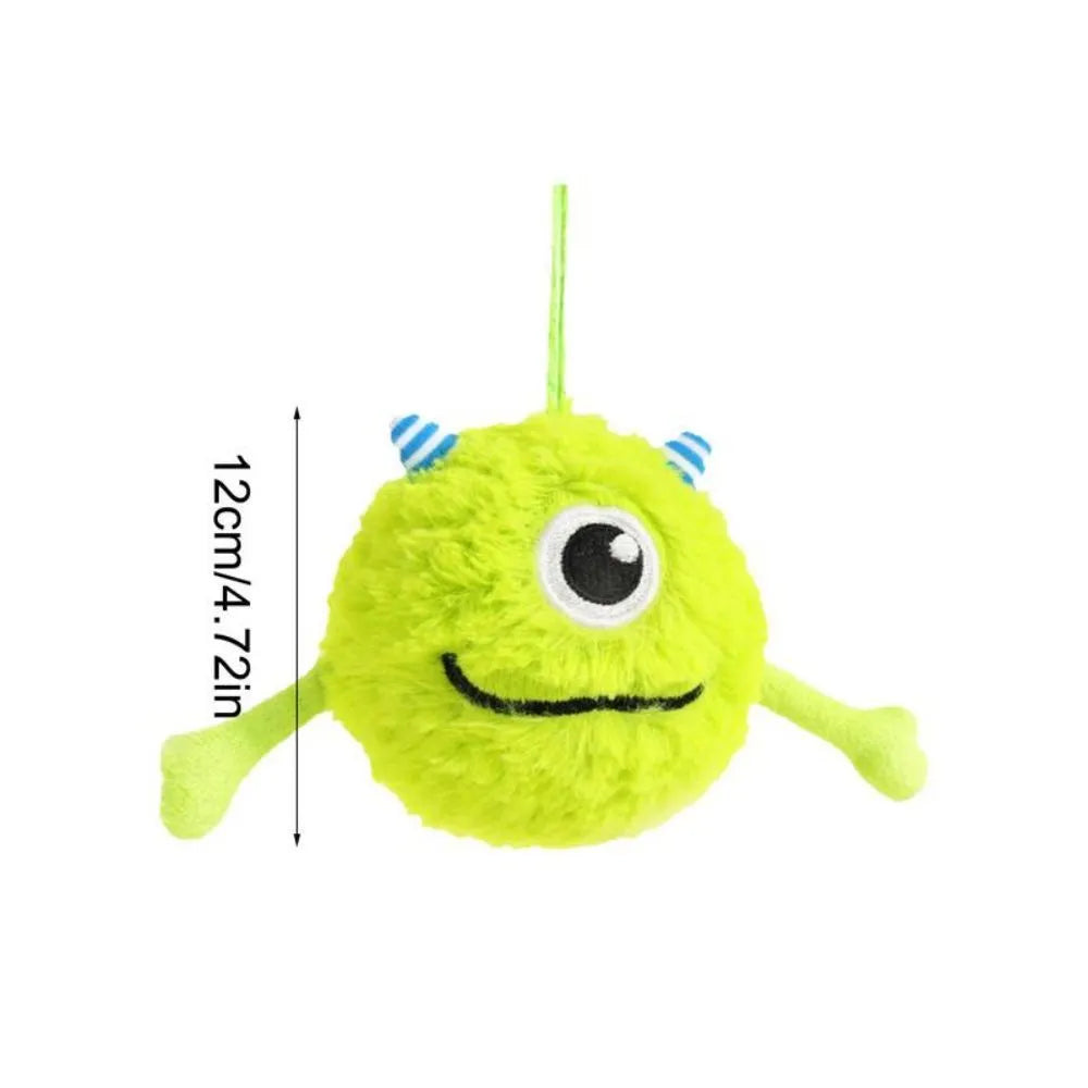 Green plush dog teething toy ball with sound activation feature, 12cm diameter