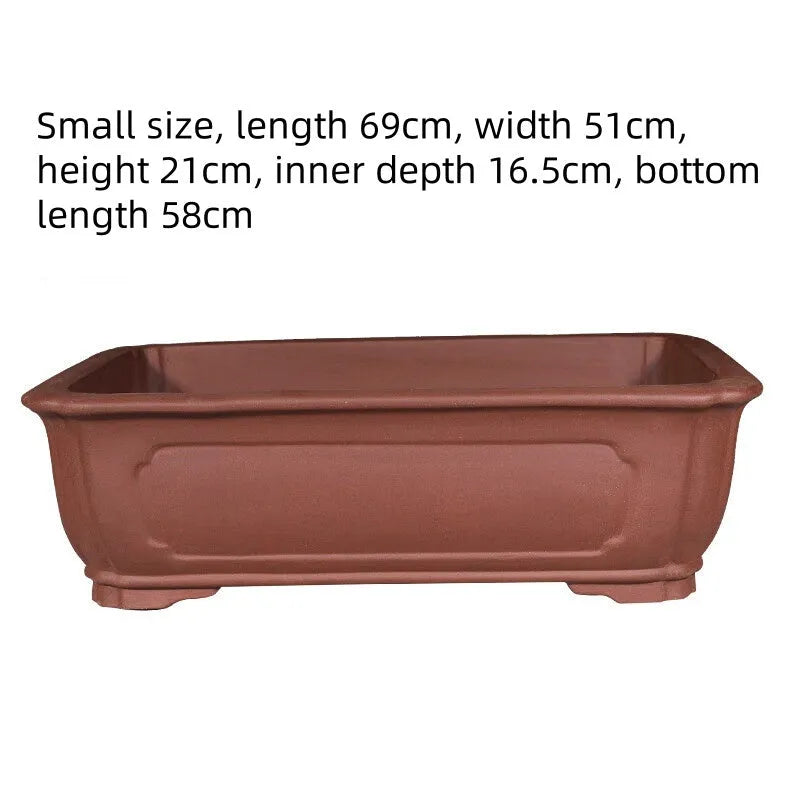 Large rectangular purple clay flowerpot for bonsai or plants, showing its handmade texture and substantial size.
