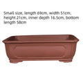 Large rectangular purple clay flowerpot for bonsai or plants, showing its handmade texture and substantial size.