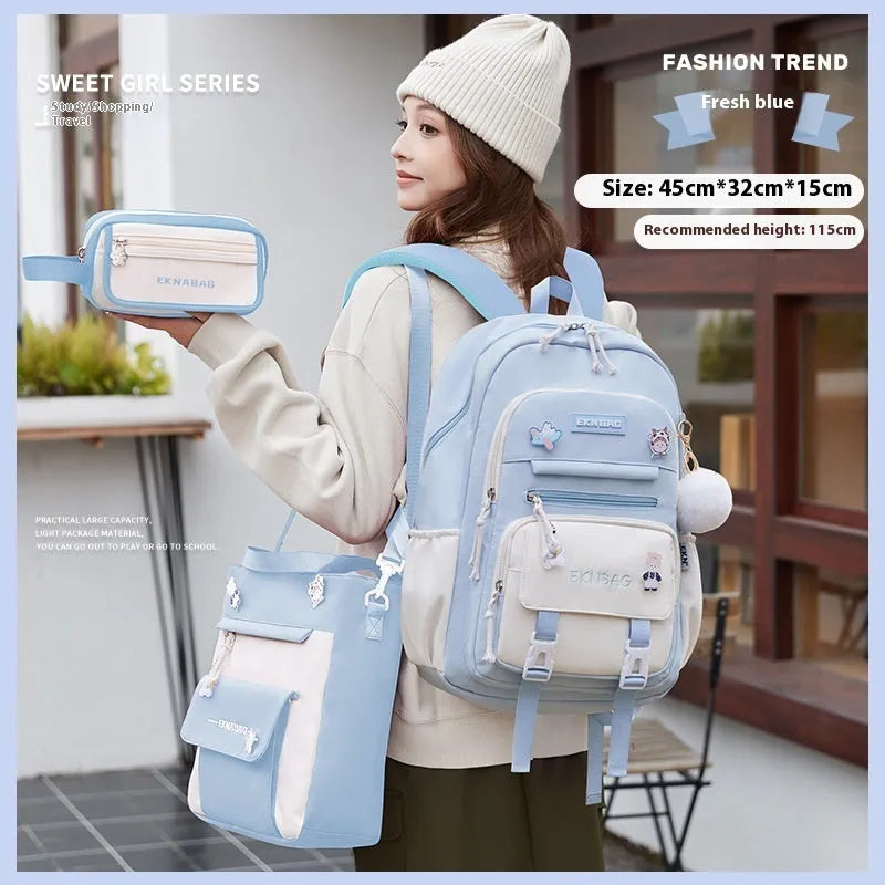 Pink waterproof Oxford cloth school backpack for girls with curved shoulder straps on a white background.
