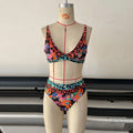 Women's high-waist floral print bikini swimsuit set on a mannequin.