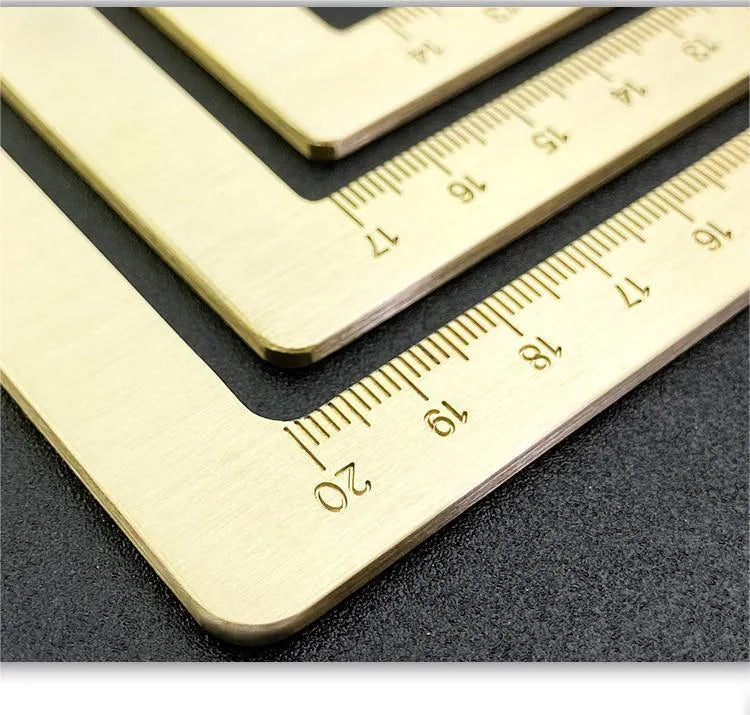 Solid brass paper weight set with engraved square design for calligraphy and writing.